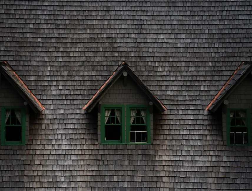 Close-up of a historic building with three charming dormer windows in Washington, USA.